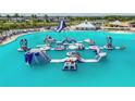 Community water park featuring slides, inflatables, and an obstacle course on a beautiful lagoon at 8100 Olive Brook Dr, Wesley Chapel, FL 33545
