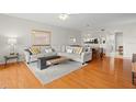 Bright open concept living room with hardwood flooring and comfortable seating at 1200 Country Club Drive Dr # 3303, Largo, FL 33771