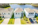 Aerial view of a home with a two car garage at 16051 Weathered Windmill Ter, Odessa, FL 33556