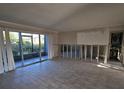 Living room view featuring an outside patio area, light-colored walls, and flooring at 200 Country Club Dr # 1303, Largo, FL 33771