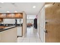 Open kitchen view showing modern appliances and granite countertops at 2595 Countryside Blvd # 8-305, Clearwater, FL 33761