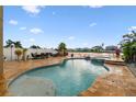 Enjoy the Florida sunshine with this pool and spa, and an expansive patio overlooking a serene lake view at 6239 French Creek Ct, Ellenton, FL 34222