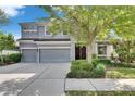 Two-story home features a three-car garage, well-maintained landscaping, and a classic design at 6423 Seasound Dr, Apollo Beach, FL 33572