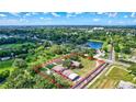 An aerial shot of the property showing the house, garden, pond, and the property's unique natural setting at 6501 62Nd N St, Pinellas Park, FL 33781