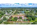 Aerial view highlighting the home's secluded setting, pond, gardens, and overall lot layout at 6501 62Nd N St, Pinellas Park, FL 33781