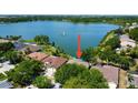 Waterfront property with stunning lake views, private dock, and lush greenery at 7123 Colonial Lake Dr, Riverview, FL 33578