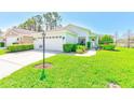 Charming single-story home boasting a lush front lawn and well-maintained landscaping at 9426 Green Needle Dr, New Port Richey, FL 34655