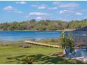 Spacious backyard featuring a private dock on a serene lake, perfect for relaxation at 18253 Townsend House Rd, Dade City, FL 33523