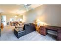 Bright living room with neutral tones, ceiling fan, and an open layout to dining area at 21011 Picasso Ct # 101, Land O Lakes, FL 34637
