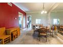 Inviting dining area with neutral colors and a large mirror, perfect for entertaining and Gathering meals at 21011 Picasso Ct # 101, Land O Lakes, FL 34637
