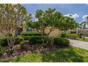 Charming single-story home with lush landscaping, mature trees and a well-maintained lawn at 2286 Sifield Greens Way # 2286, Sun City Center, FL 33573