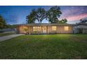 Charming single-story home featuring a well-manicured lawn and inviting curb appeal at 2707 Morningside Dr, Clearwater, FL 33759
