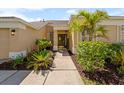 Inviting front entrance featuring lush landscaping and a welcoming door perfect for any homeowner at 5123 Whispering Leaf Trl, Valrico, FL 33596