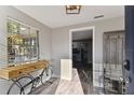Entryway with wood-look floors, view to living and dining, and unique decor at 6316 S Richard Ave, Tampa, FL 33616