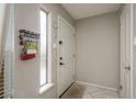 Clean entryway with neutral paint, a window for natural light, and a white front door at 6475 23Rd N St, St Petersburg, FL 33702