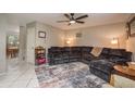 Inviting living room with tile floors, neutral walls, ceiling fan, and a comfortable sectional sofa at 6475 23Rd N St, St Petersburg, FL 33702