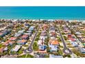 Coastal neighborhood featuring charming homes with manicured lawns and easy access to the beach at 115 16Th St, Belleair Beach, FL 33786