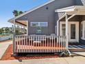 Relaxing outdoor deck with comfortable seating and charming decor, ideal for leisure at 115 16Th St, Belleair Beach, FL 33786