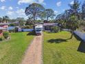 Charming home featuring a gravel driveway and ample green space, perfect for outdoor living at 1516 Massachusetts Ne Ave, St Petersburg, FL 33703