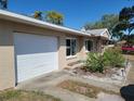 Charming home with a well-maintained lawn and attached garage at 2850 41St N St, St Petersburg, FL 33713