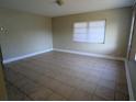 Inviting living room with neutral walls and tile flooring at 3905 W Carmen St, Tampa, FL 33609