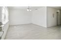 Bright living room featuring neutral walls, and new hardwood flooring at 4005 W Nassau St, Tampa, FL 33607