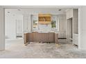 Spacious kitchen displaying unfinished elements, including cabinets and a central island at 116 19Th Se Ave, St Petersburg, FL 33705