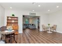 Open-concept living area with wood flooring, neutral walls, and stylish furniture at 13596 Croft N Dr, Largo, FL 33774