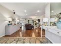 Spacious living room featuring wood floors, elegant decor, and an inviting atmosphere at 18846 Tracer Dr, Lutz, FL 33549