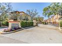 Seagate community entrance with well manicured landscaping and a secure gate at 254 Seagate Ct, Dunedin, FL 34698