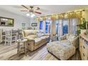 Cozy living room featuring stylish furniture, decorative accents, and plenty of natural light at 3632 Pine Cone Cir, Clearwater, FL 33760