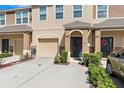 A well-maintained multi-Gathering unit with attached garages and manicured landscaping creates inviting curb appeal at 4081 71St N Ter, Pinellas Park, FL 33781