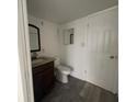 Bathroom featuring a granite vanity, a modern mirror, and updated fixtures at 7529 Pitch Pine Cir # 190, Tampa, FL 33617