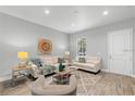 Bright living room featuring stylish furnishings, wood floors, and recessed lighting at 9303 N 19Th St, Tampa, FL 33612