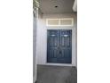 Inviting home entrance featuring double doors, a neutral color scheme, and classic architectural details at 2105 Haydon Ct, Brandon, FL 33511