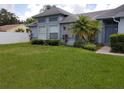 Charming single-story home with lush green lawn and decorative landscaping for pleasant curb appeal at 2105 Haydon Ct, Brandon, FL 33511