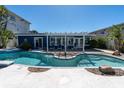 Sparkling pool with a pergola-covered patio perfect for outdoor entertaining at 11125 7Th E St, Treasure Island, FL 33706