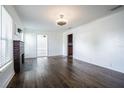 Spacious living room boasts hardwood floors, natural light, and a decorative fireplace at 1807 23Rd N Ave, St Petersburg, FL 33713