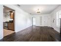 Open living room and kitchen area features hardwood floors, natural light, and modern fixtures at 1807 23Rd N Ave, St Petersburg, FL 33713