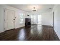 Bright living room featuring hardwood floors, natural light, and inviting front door at 1807 23Rd N Ave, St Petersburg, FL 33713