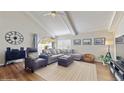 Bright living room with wood floors, high ceilings, modern furniture and large windows at 2572 Forest Run Ct, Clearwater, FL 33761