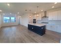 Bright, open-concept kitchen featuring a large island, modern appliances, and pendant lighting at 2832 Marrakesh Ln, Sarasota, FL 34234