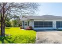 Charming home featuring a two-car garage, stone accents, and a well-kept lawn at 3346 Gorse Ct, Palm Harbor, FL 34684