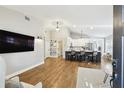 Open-concept living space flowing into a kitchen with breakfast bar at 3823 W Obispo St, Tampa, FL 33629