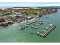 Wonderful aerial view of marina, nearby restaurants, golf course, and beach and bridge in the distance at 6140 Sun Blvd # 7, St Petersburg, FL 33715