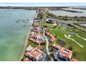 Breathtaking aerial view of the community, nestled along the water, golf course, and nearby beaches at 6140 Sun Blvd # 7, St Petersburg, FL 33715
