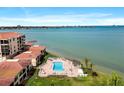 Picturesque aerial shot highlighting the community's pool, waterfront location, and coastal living ambiance at 6140 Sun Blvd # 7, St Petersburg, FL 33715