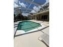 An inviting in-ground pool is surrounded by a spacious screened lanai for the ultimate outdoor living experience at 10220 Deercliff Dr, Tampa, FL 33647