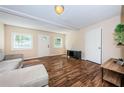 Inviting living room featuring stylish wood floors, neutral walls, and a cozy seating area at 1104 E Genesee St, Tampa, FL 33603