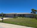 Lovely one-story home with well-kept lawn and neutral exterior color scheme at 3122 Egret Ter, Safety Harbor, FL 34695